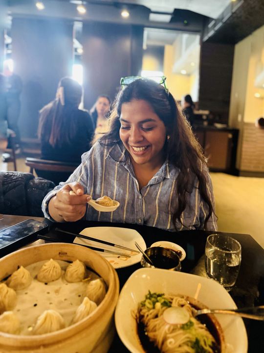Aalvee enjoying soup dumplings