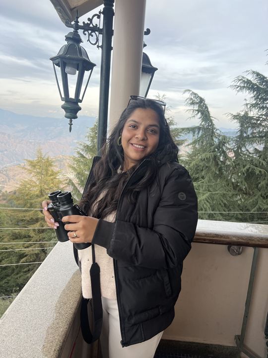 Aalvee with binoculars in the mountains